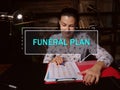 FUNERAL PLAN phrase on the screen. Auditor analyzing market research results. AÃÂ Funeral PlanÃÂ is an easy way to pre-arrange the